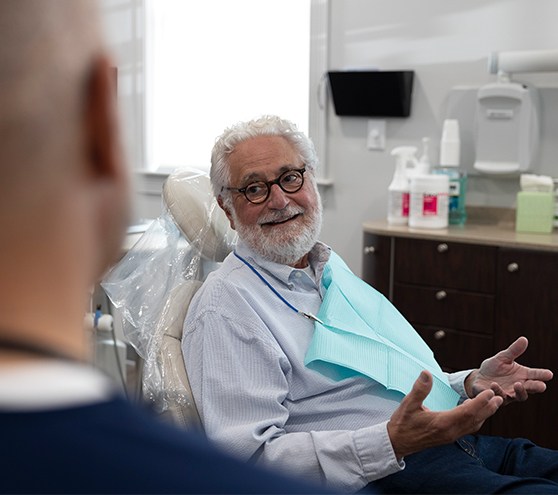 Dental patient smiling at dentist