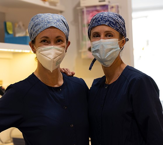 Two dental patients wearing protective face masks