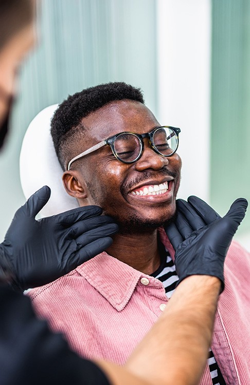 Man smiling at the dentist