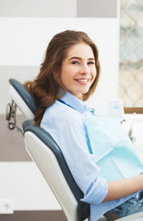 a patient visiting her dentist in New Bedford, MA