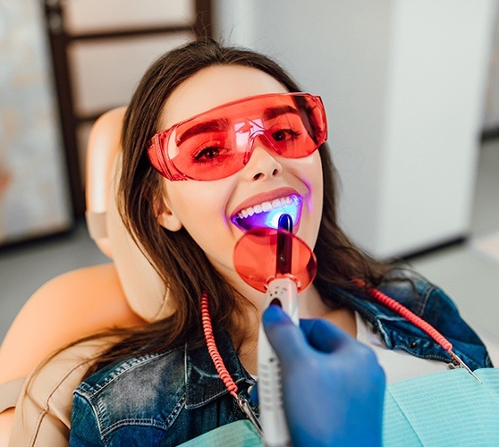 Patient receiving dental bonding treatment