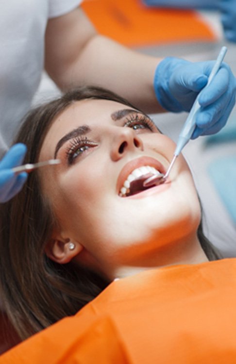 a patient visiting her dentist in New Bedford, MA