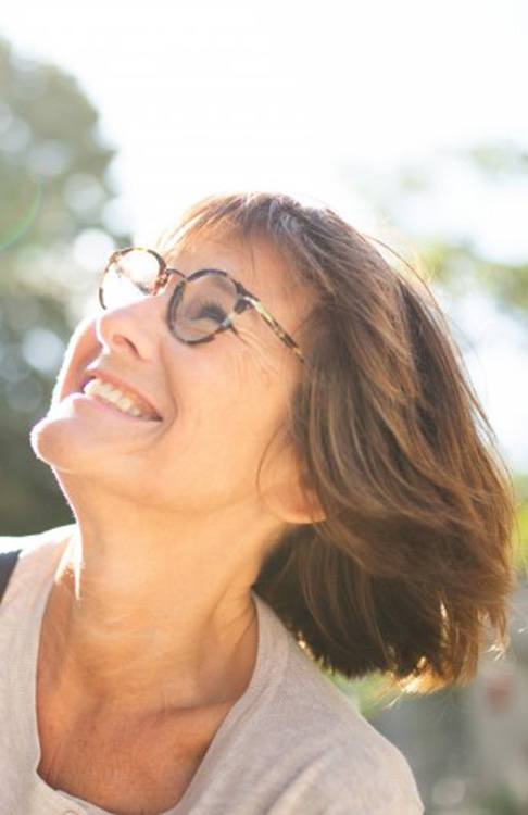 Lady smiles in sunlight