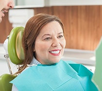 Woman smiling in the dental chair