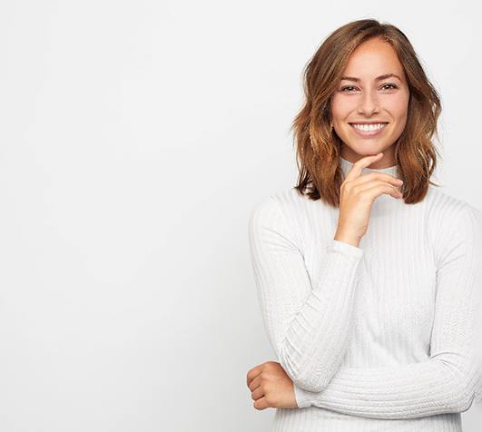 a smiling after undergoing Invisalign in New Bedford