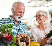 older couple shopping for healthy vegetables together 