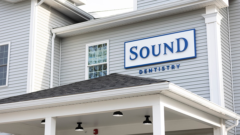 Sound Dentistry sign on the exterior of the New Bedford Massachusetts dental office building