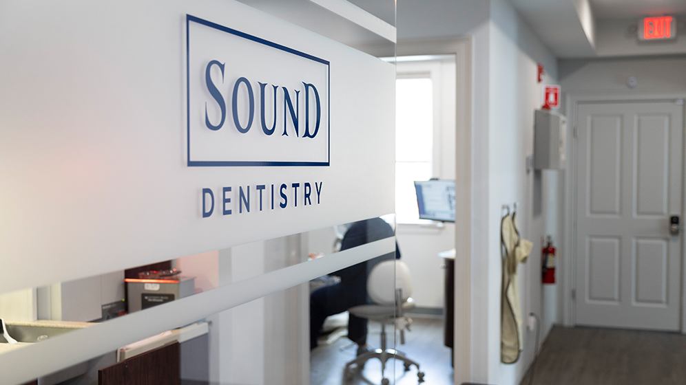 Sound Dentistry sign on dental office door