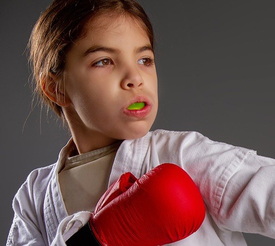 Preteen girl with green sportsguard