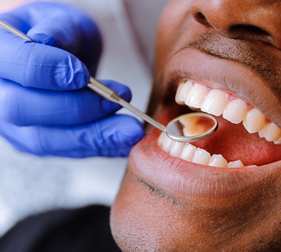 Dental patient receiving oral cancer screening