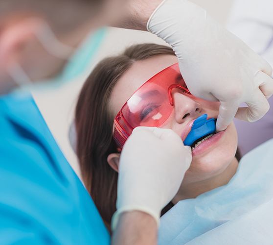 Dental patient receiving fluoride treatment