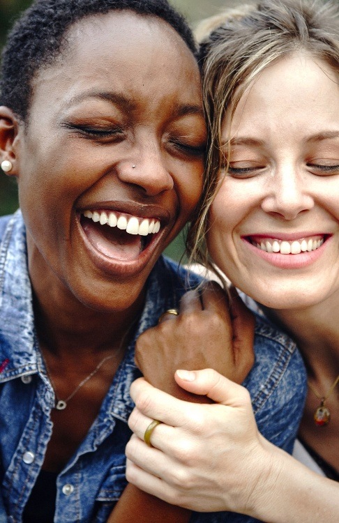 Two women with healthy smiles after dental services