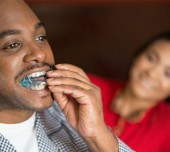 Man placing an oral appliance