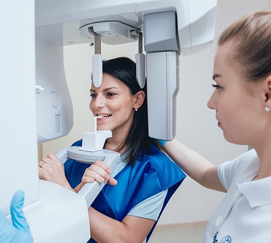 Patient receiving C T cone beam x-ray scans