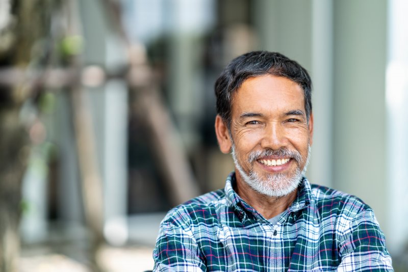 Man smiling with dental implants