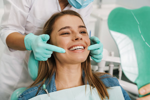 Young patient talking to their dentist