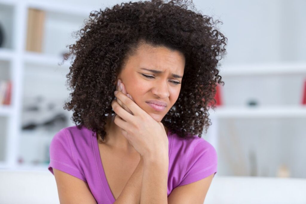 A woman with jaw pain