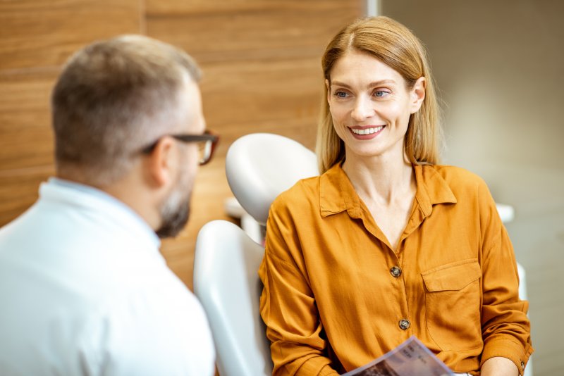 middle-aged woman visiting her dentist